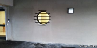 grille oeil de boeuf fer horizontal scellement facade forge catalane