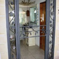 porte vitree cintree inspiration vegetale fer Forge Catalane Cabestany